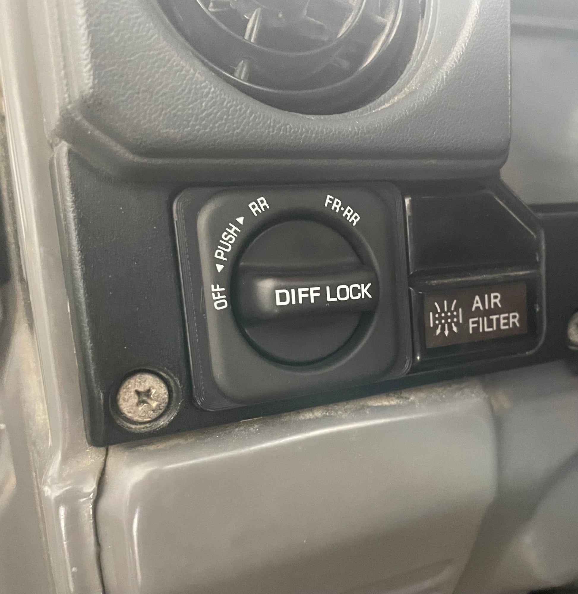 picture shown of switch inserted into dash of Land Crusier