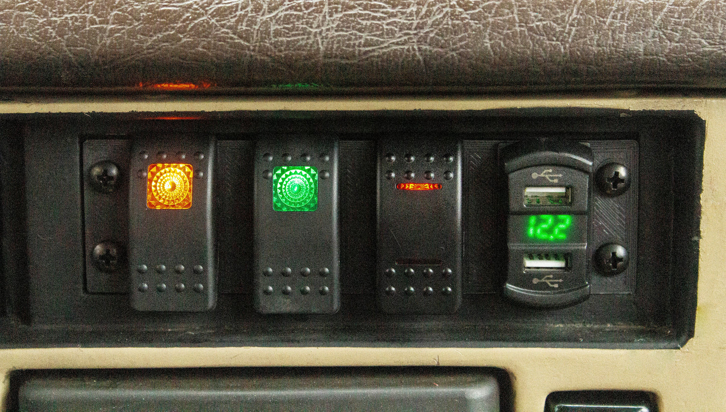 Close up of installed panel with carling switches on the FJ60 dash bezel